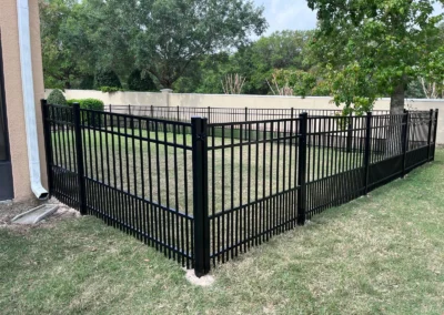 Aluminum fencing for puppy safety, with double-spaced pickets at the bottom, designed to prevent small dogs from squeezing through while maintaining an open and stylish look.