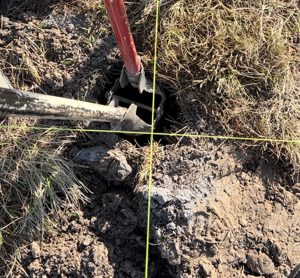Post Hole-and-String Lines Post hole digging with string lines by Primo Fence for accurate fence installation.